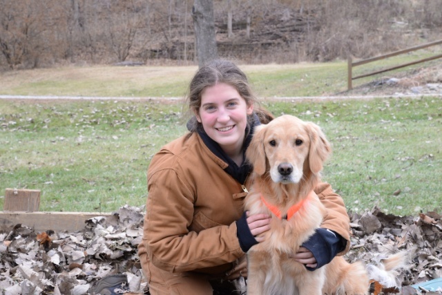 Image of Hannah and her dog, Sadie. Curiosity about a cat is this story!