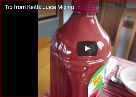 Still photo of juice mixing.